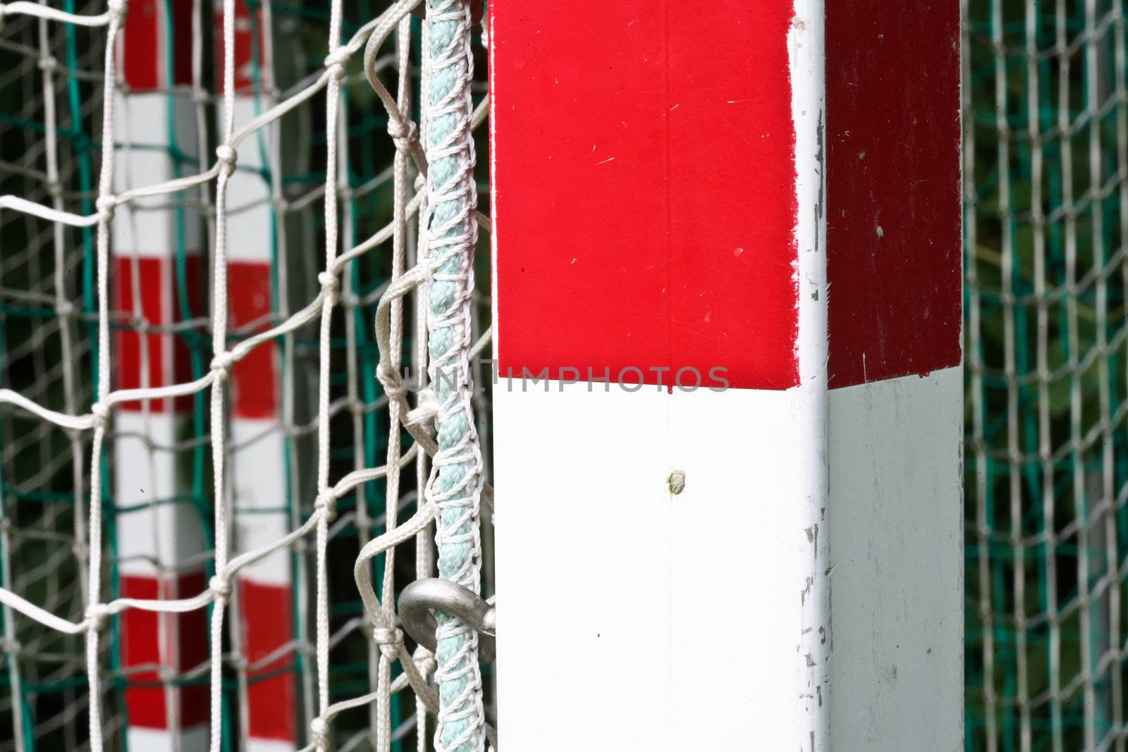 detail of a handball goal with red and white stripes