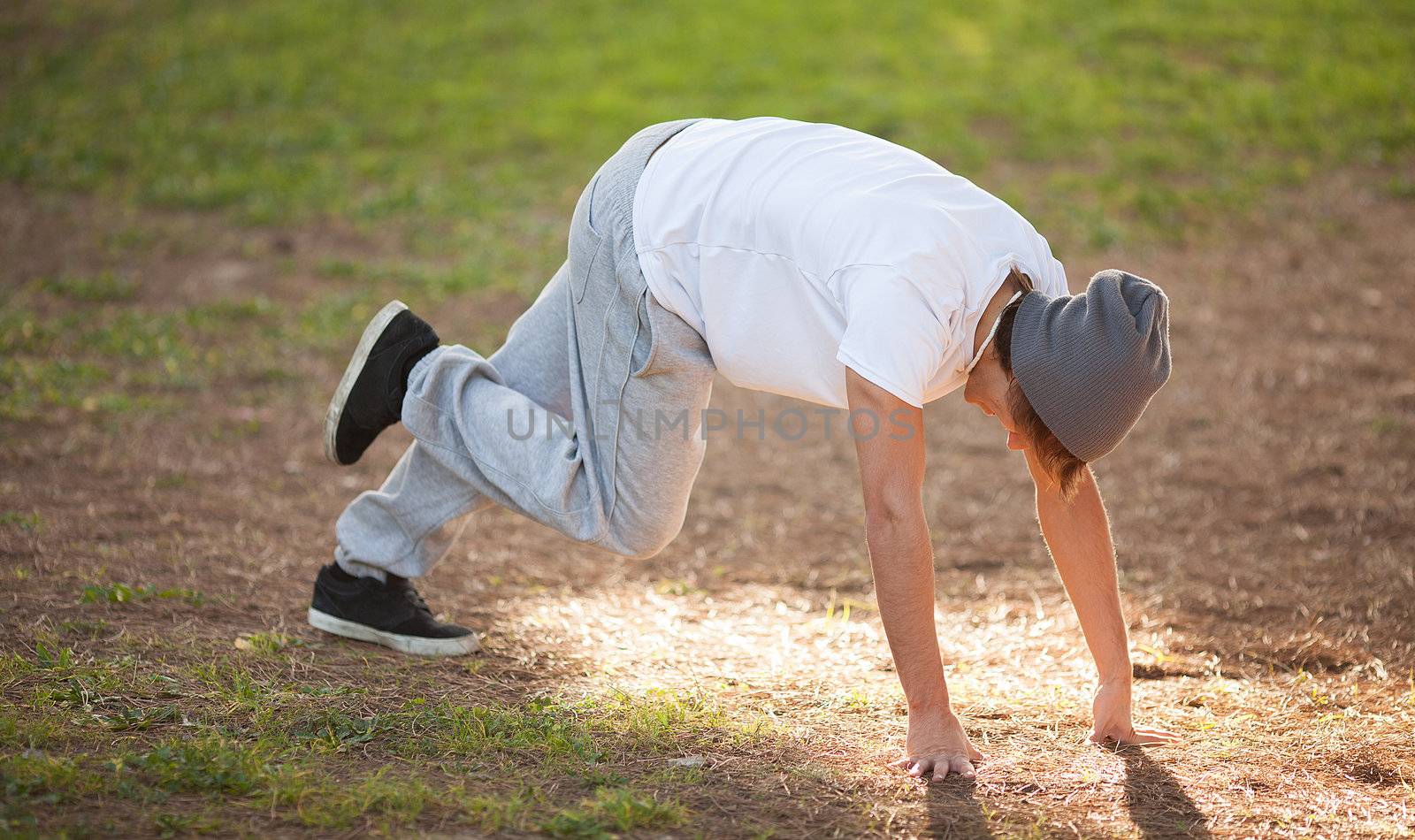 young man portrait stretching after jogging