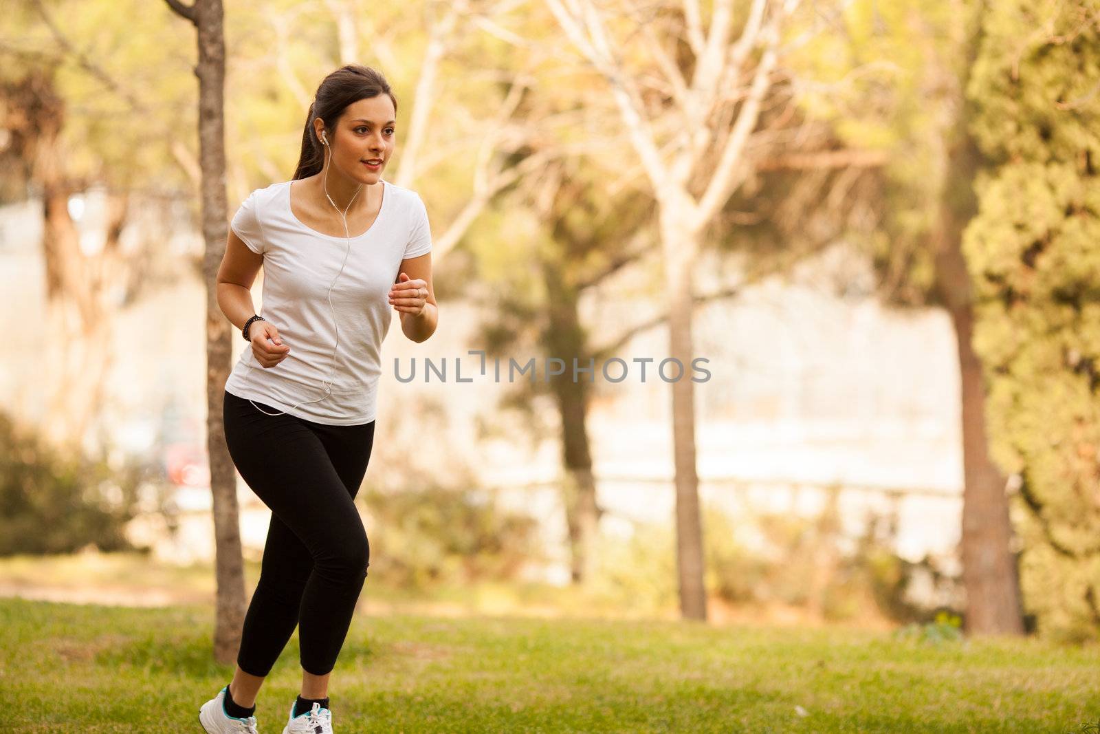 young beautiful woman jogging outdoors