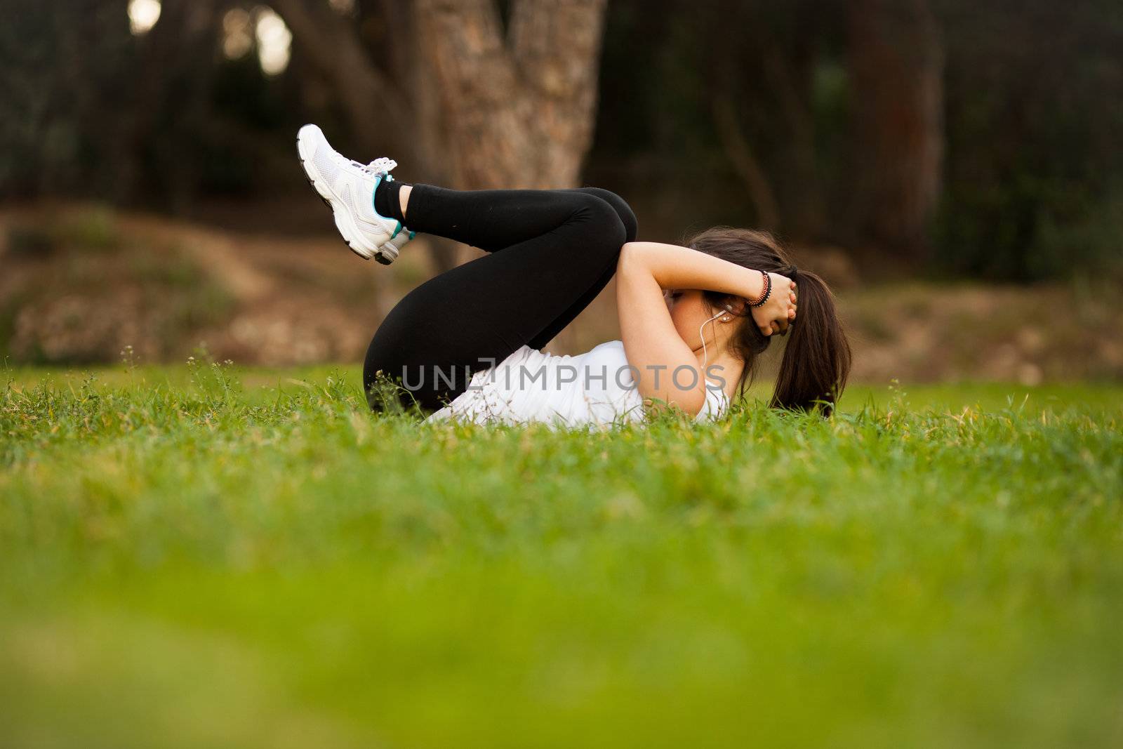 young beautiful latin woman making abs by Lcrespi