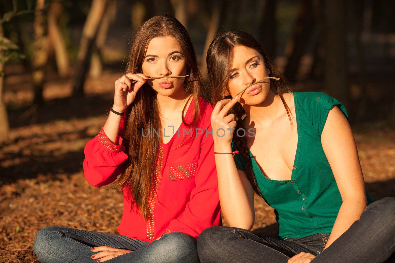 young girlfriends playing and having fun on a park