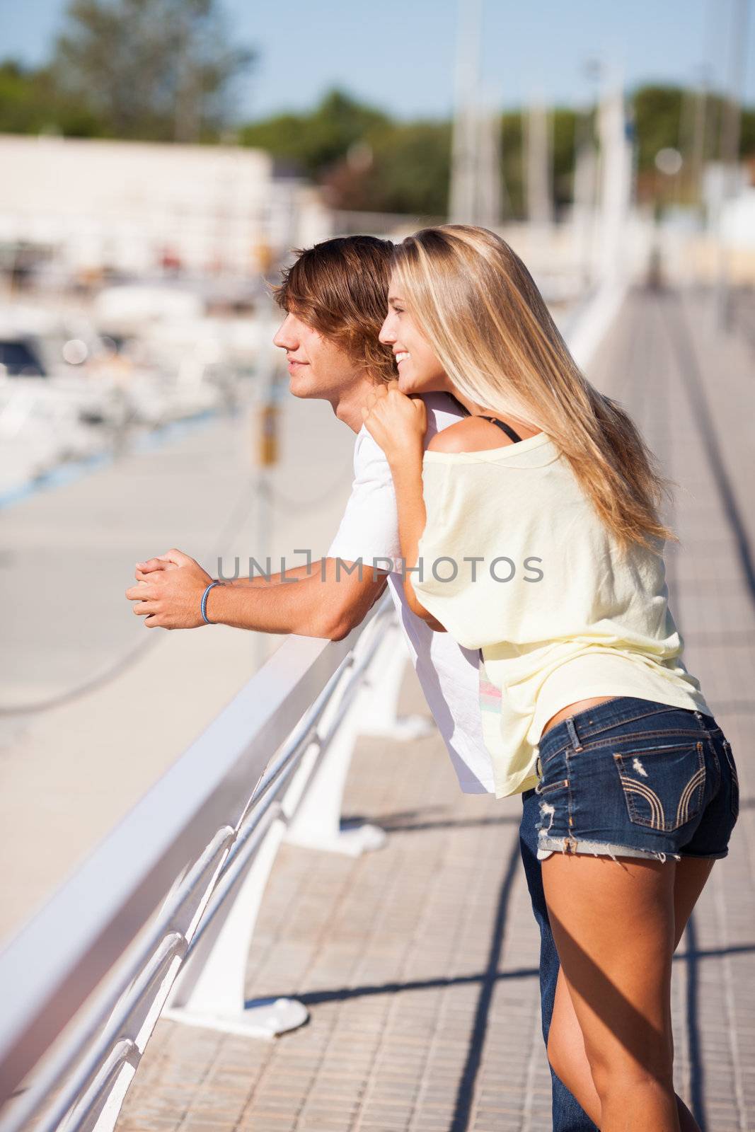 Young beautiful couple enjoying a walk by Lcrespi