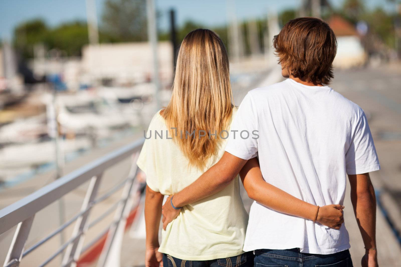 Young beautiful couple enjoying a walk by Lcrespi