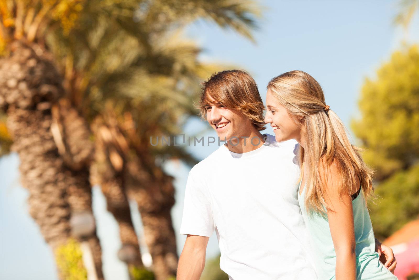 Young romantic beautiful couple enjoying on a walkside  by Lcrespi