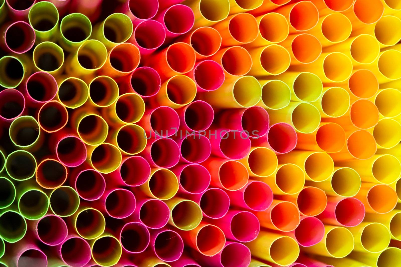 Close up picture of many colorful straws