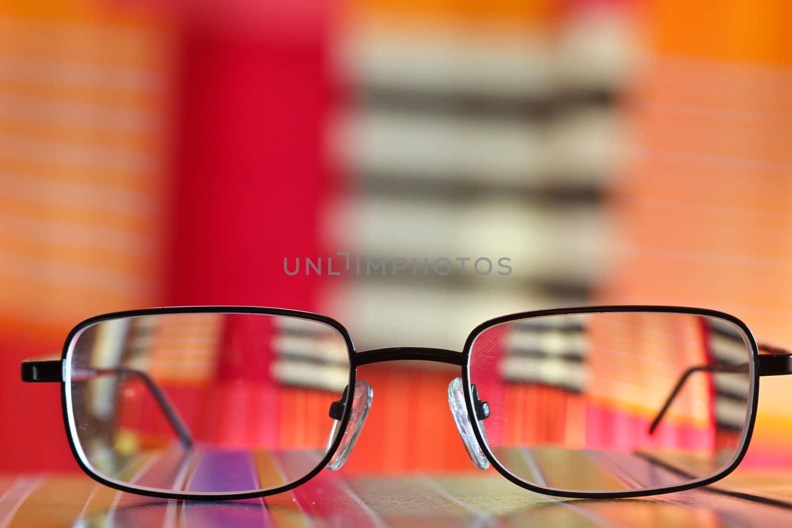 Pair of glasses tanding on a table