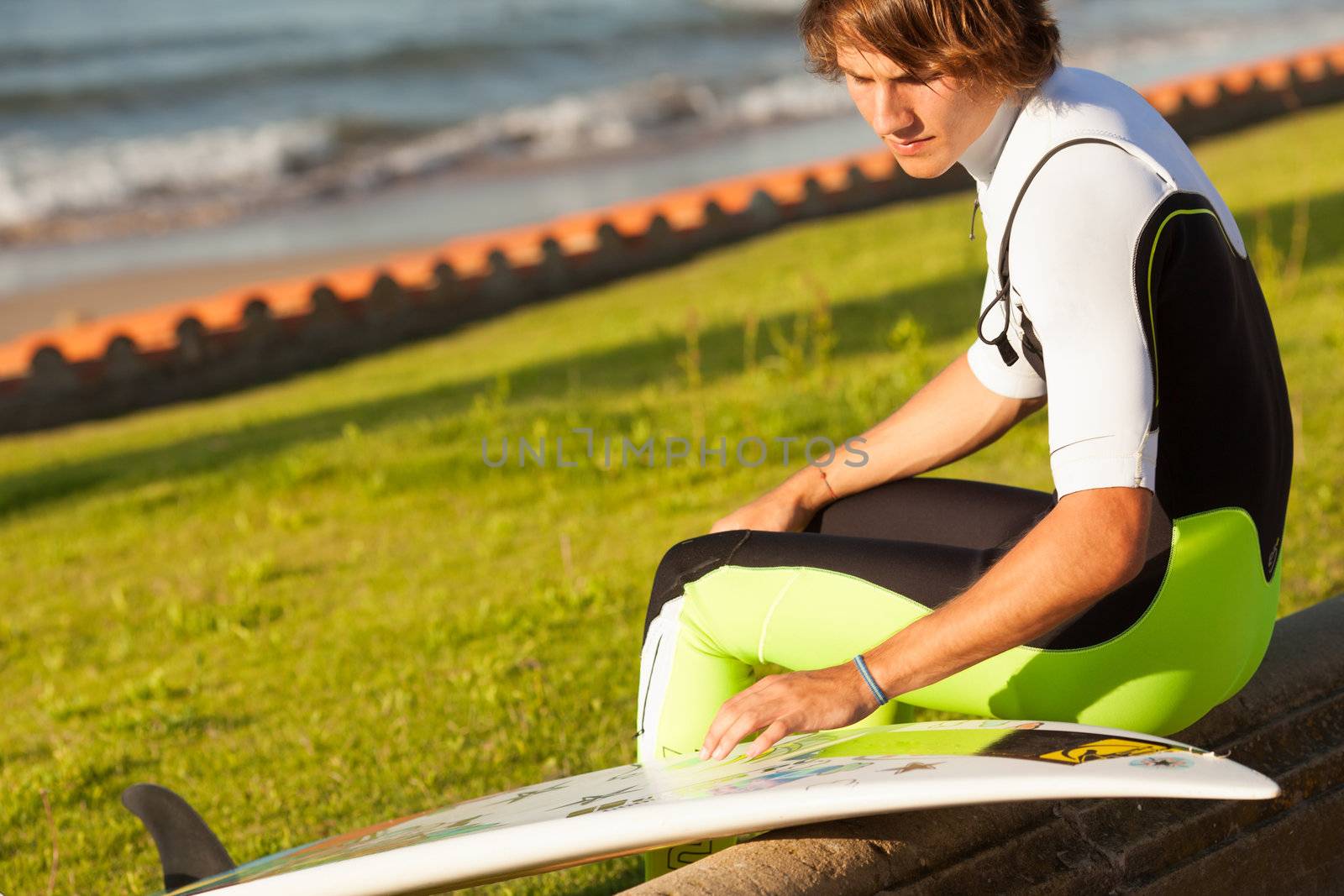 young surfer about to get into the sea