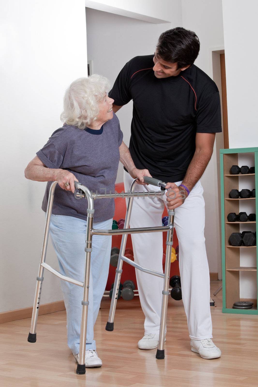 Therapist helping Patient use Walker by leaf