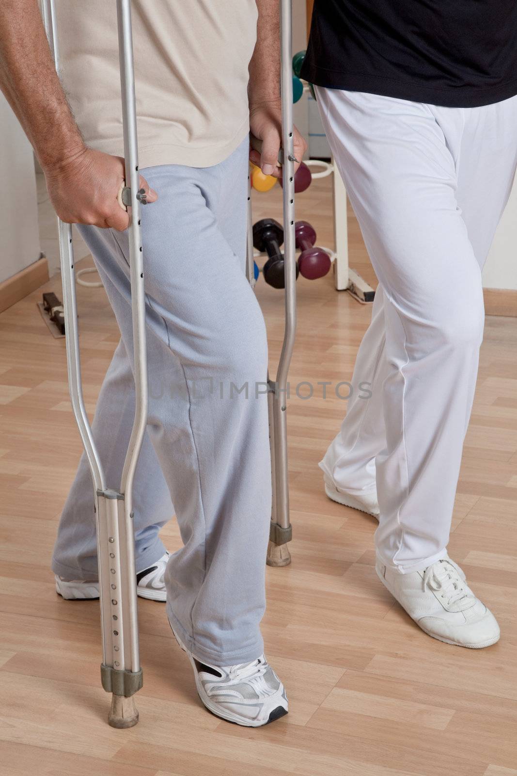 Patient on crutches discusses his progress.
