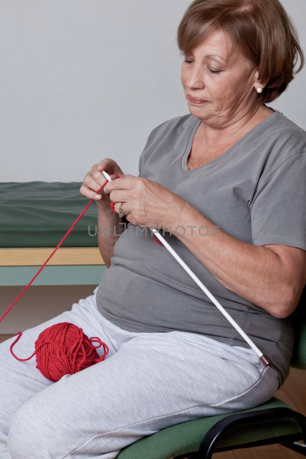 Portrait of a senior woman knitting.