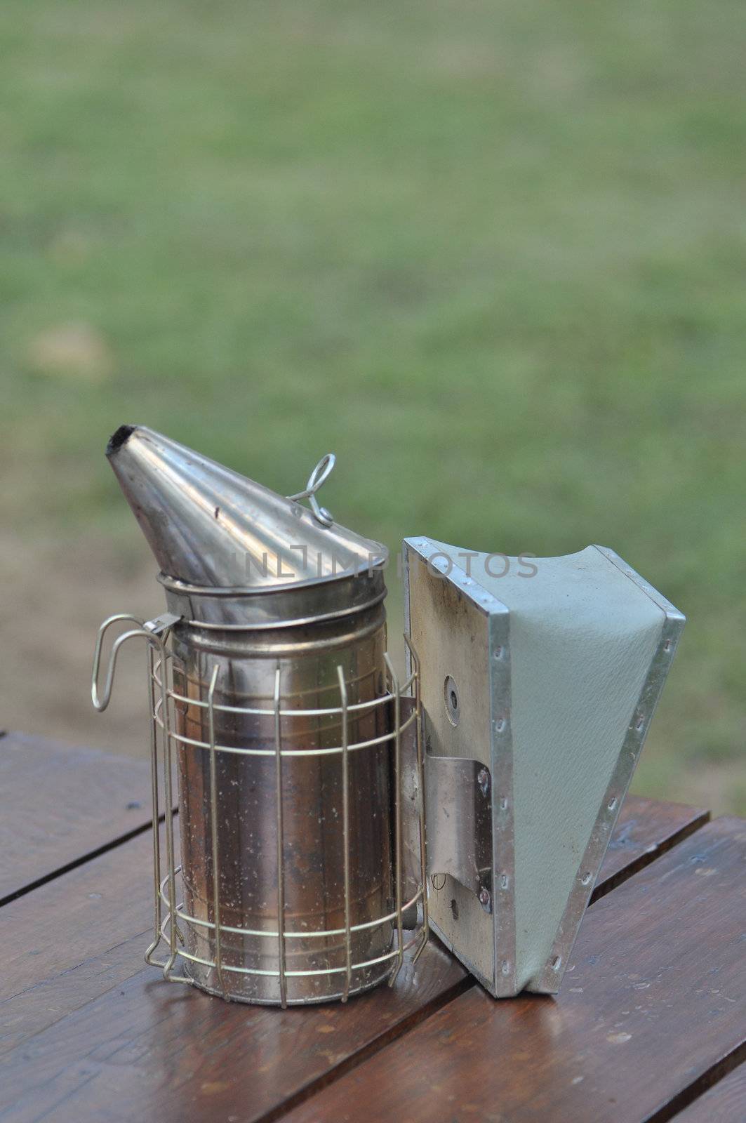 Manual bee fogger used to blow smoke into hives and put honey bees to "sleep"