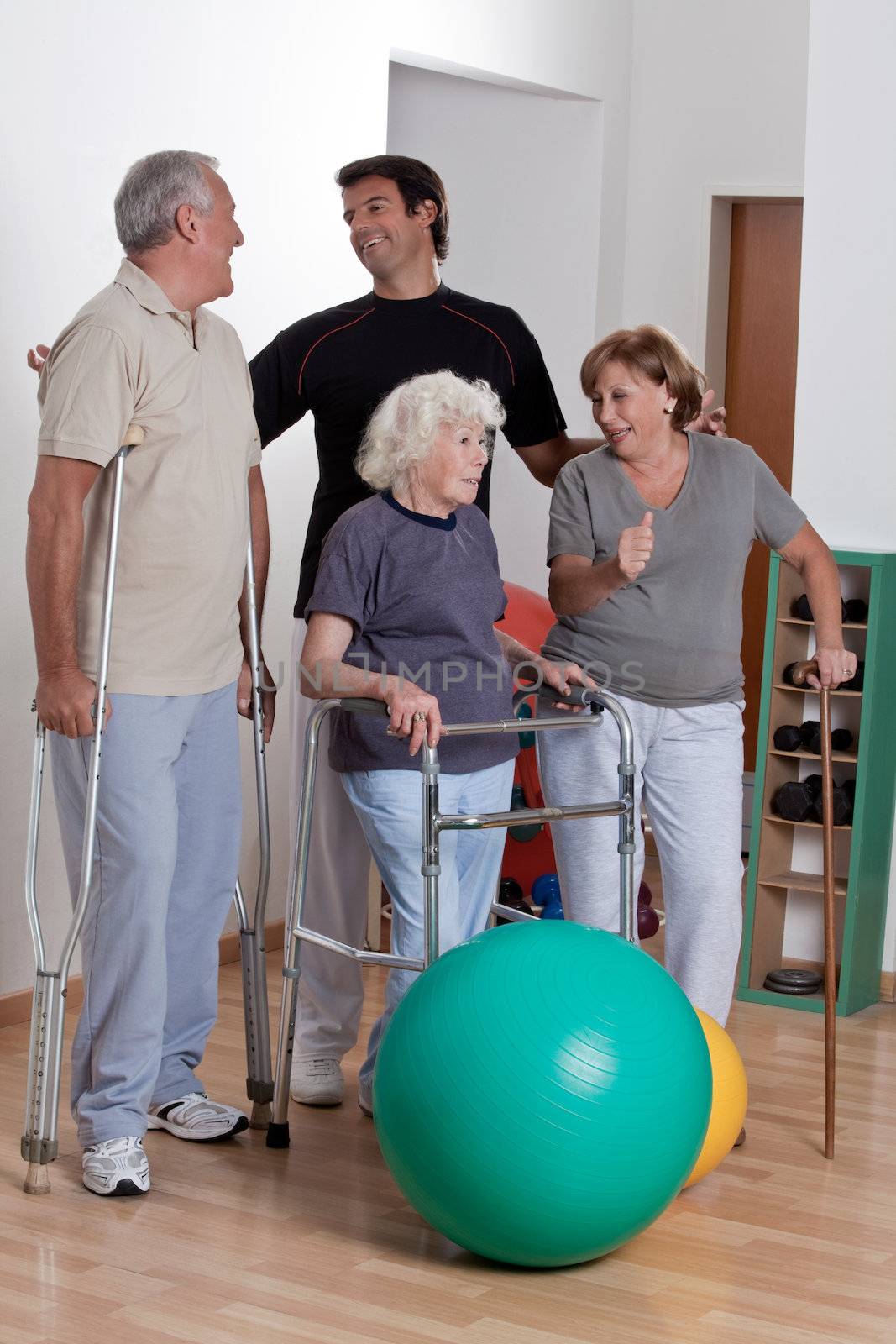 Male Physical Therapist with Patient by leaf