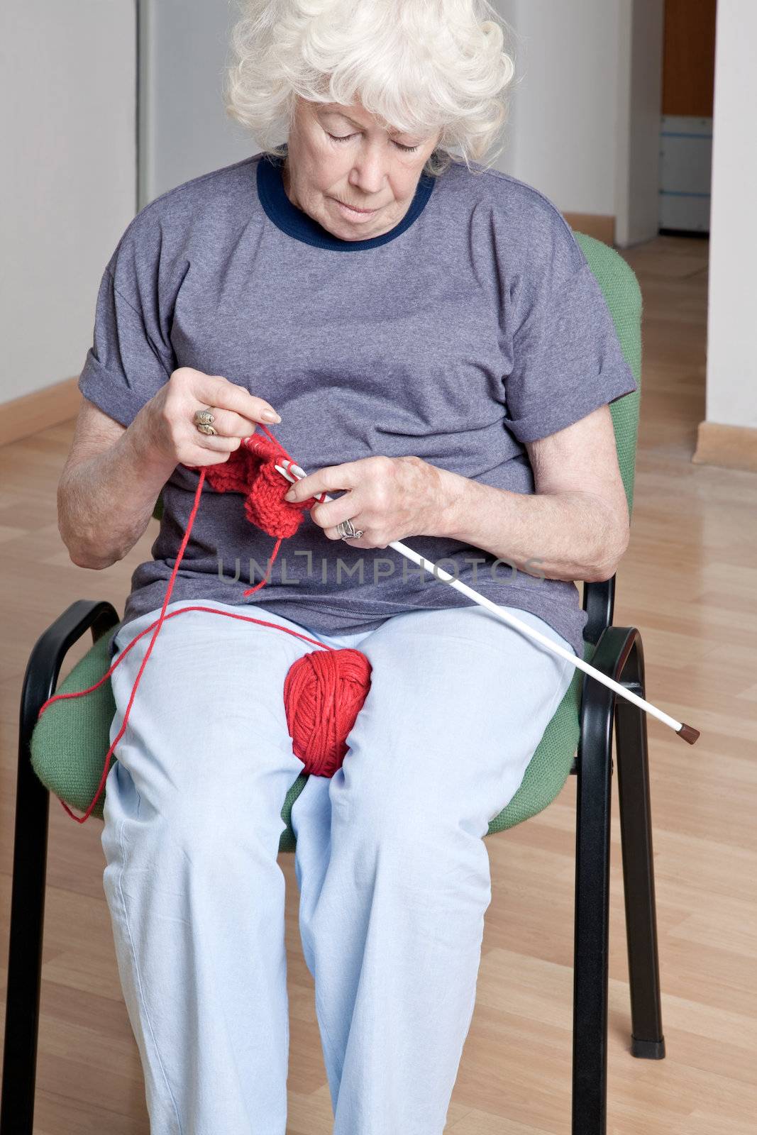 Portrait of a senior woman knitting.