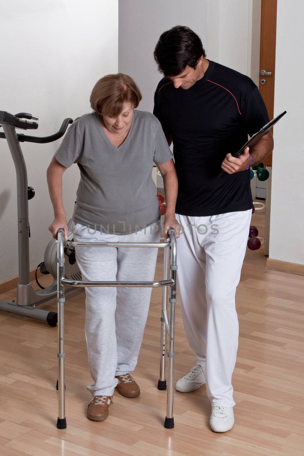 Therapist Helping Patient use Walker.