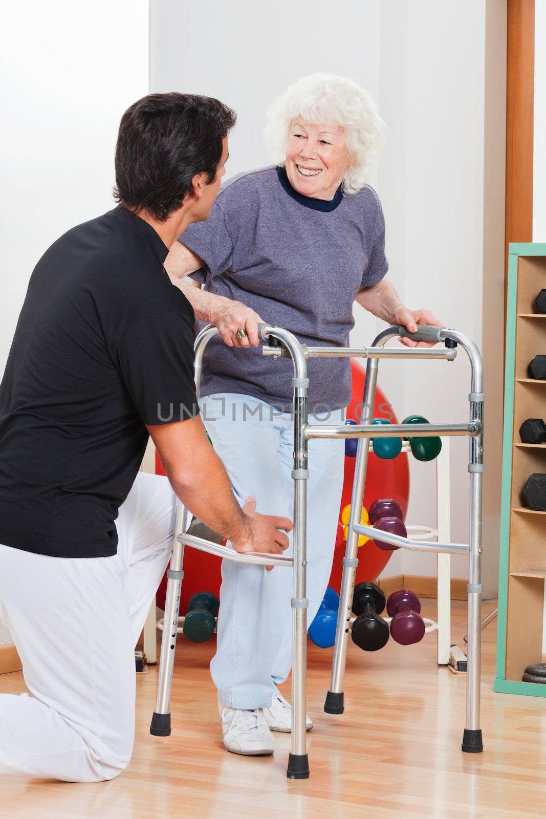 Woman With Walker Looking At Trainer by leaf