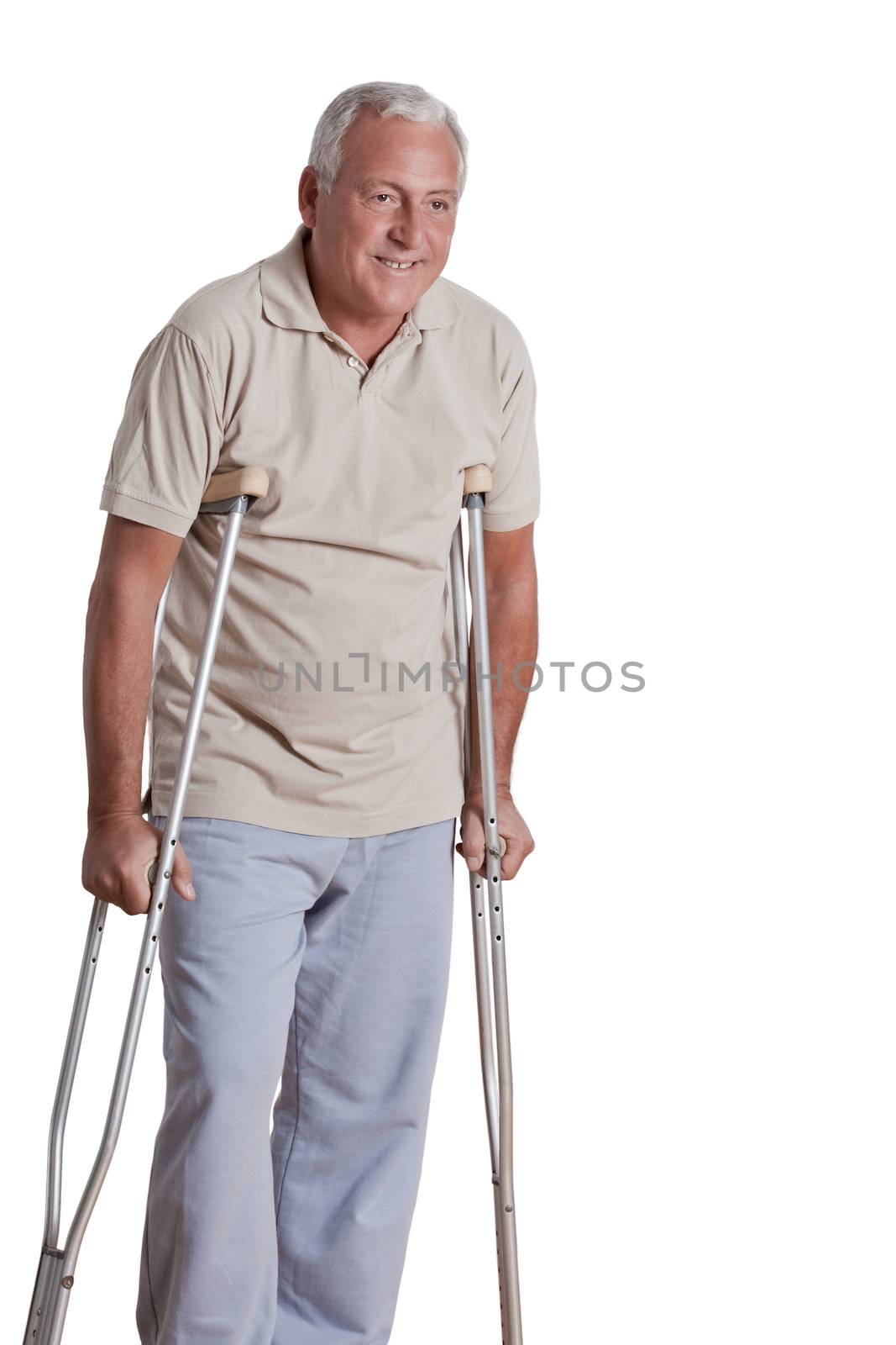 Senior man with crutches and females doing physical exercise .