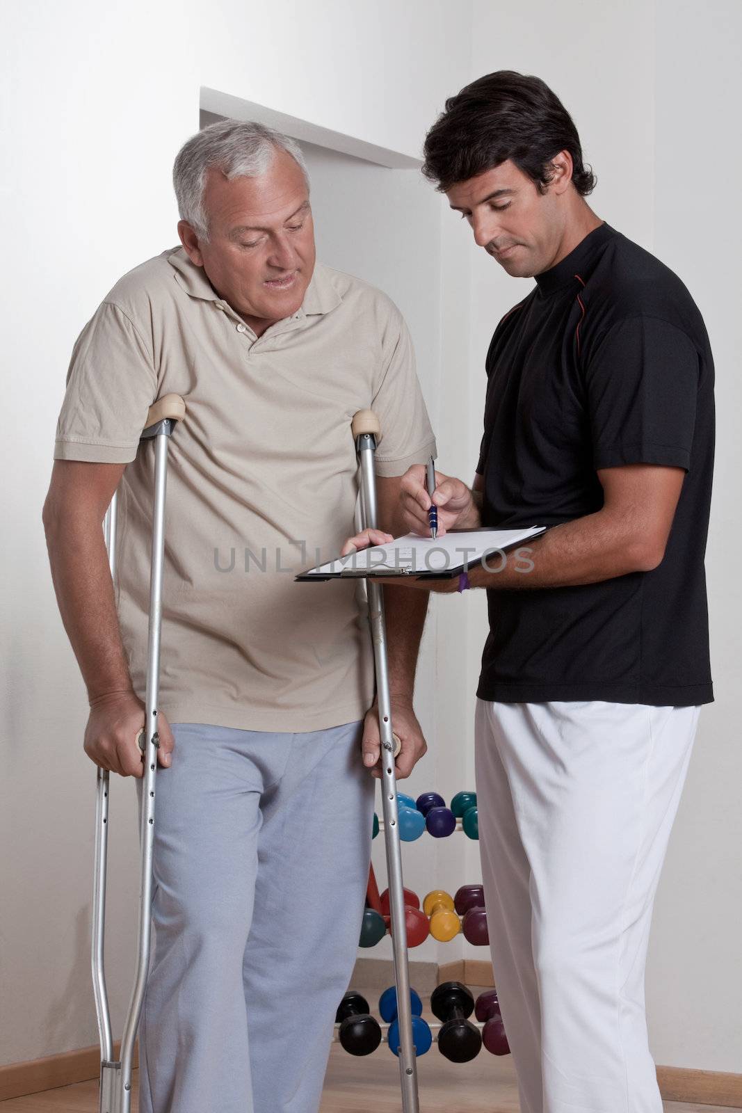 Patient on Crutches and Physician by leaf