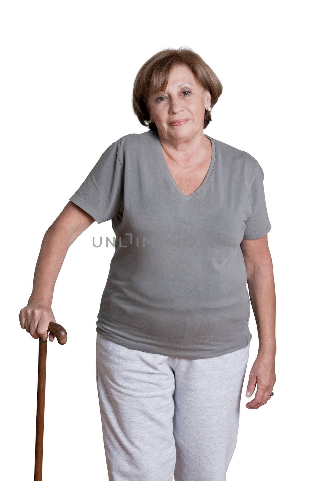 Mature Woman with Walking Stick by leaf