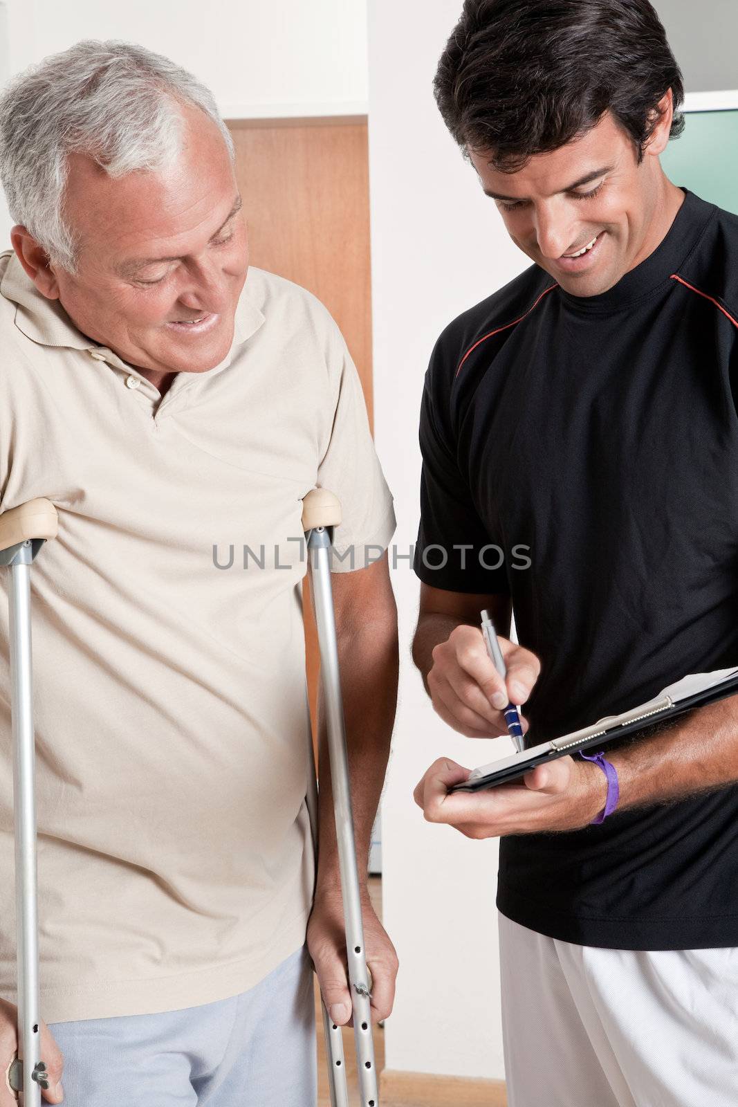Patient on Crutches and Physician by leaf
