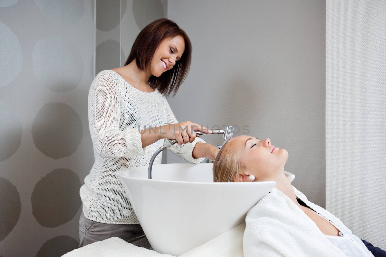 Beautician Washing Hair Of Customer by leaf