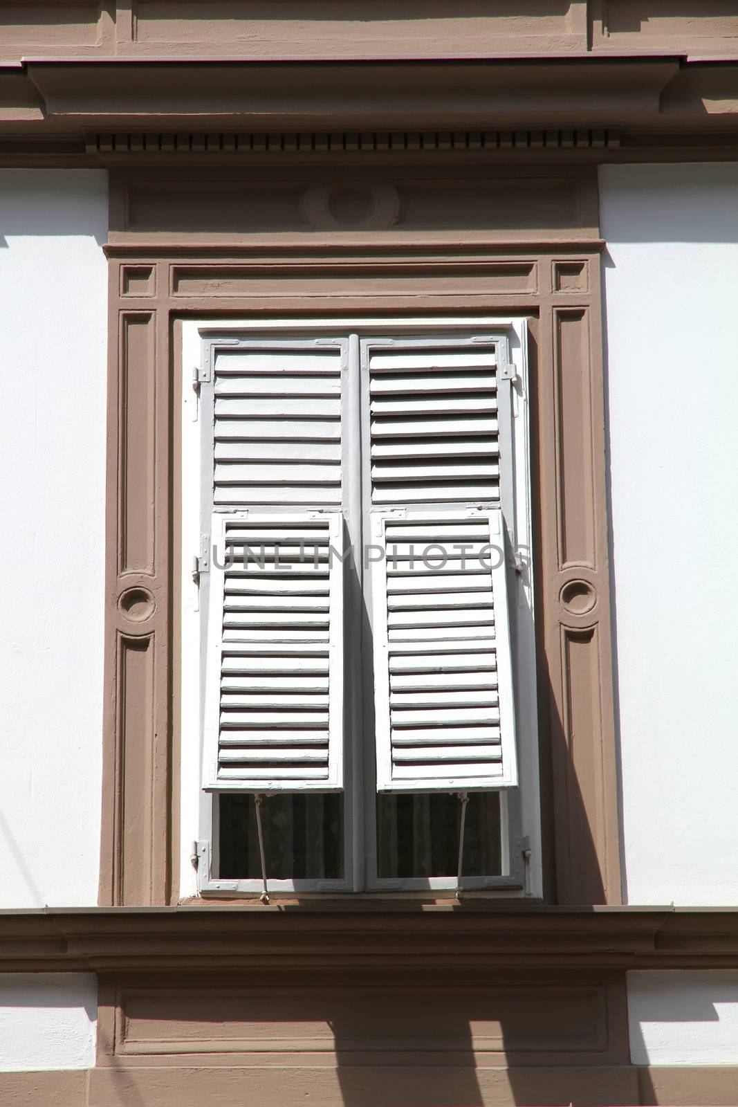 Old window with shutters in Graz, Austria, Europe.