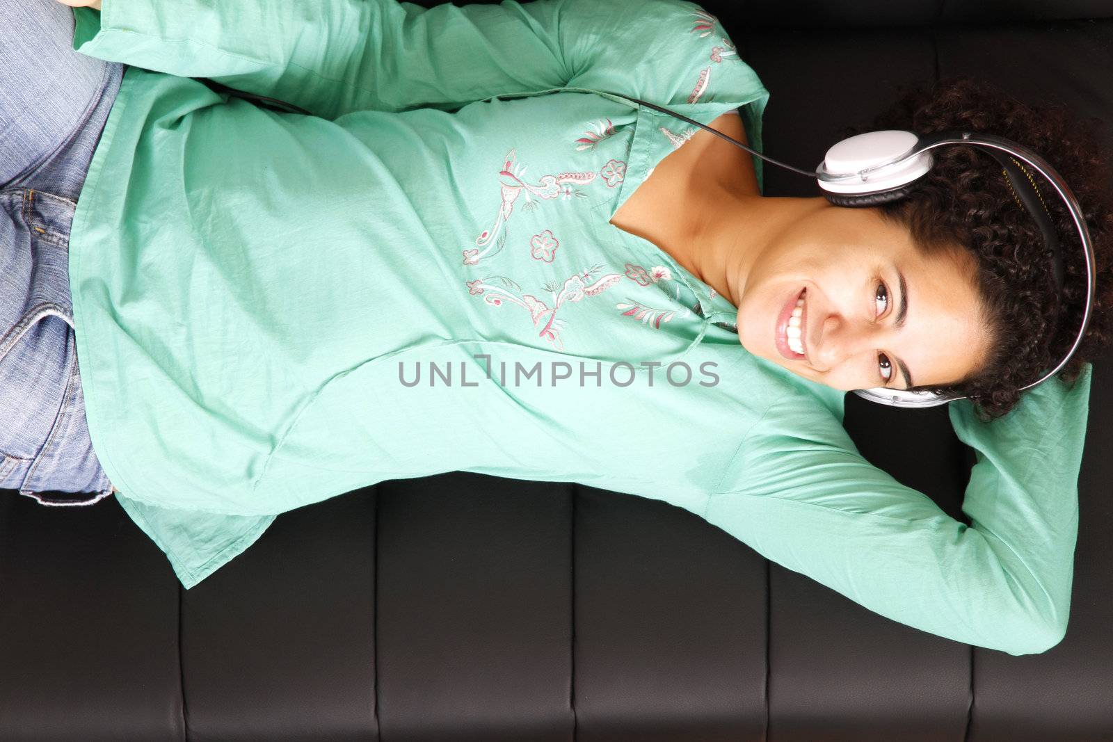 A jung brazilian woman relaxing on the sofa.