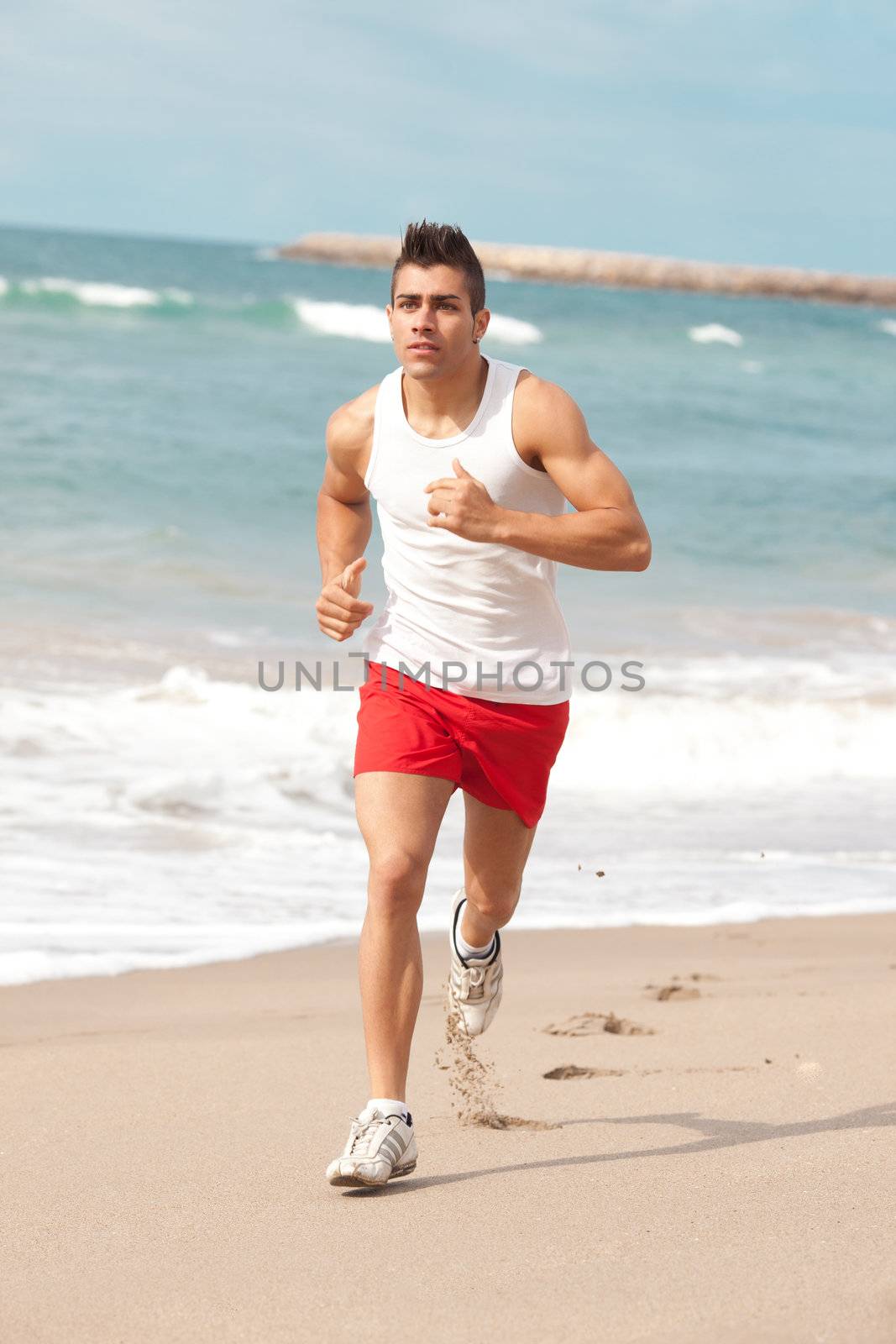 young handsome man jogging outdoors