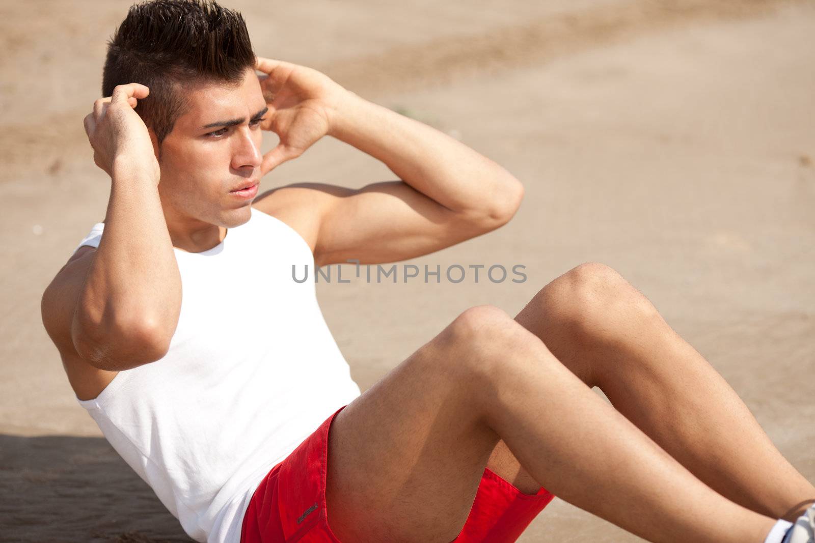 young handsome man making abs workout