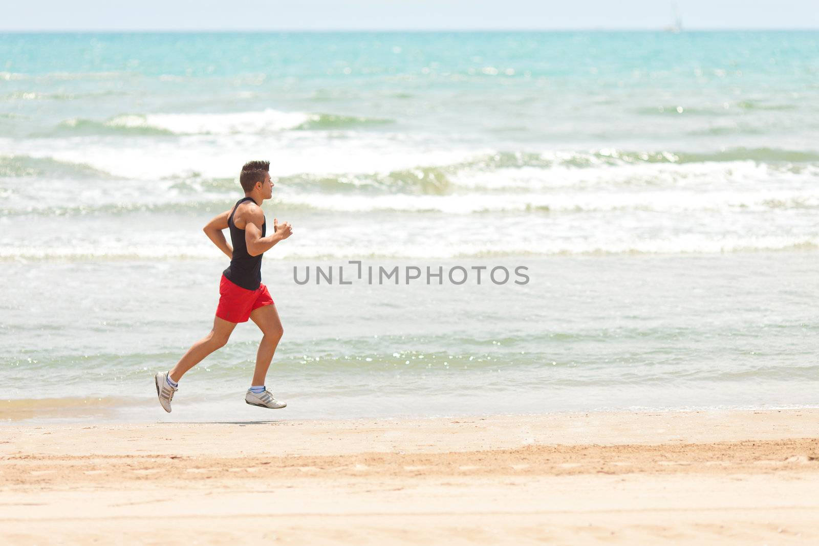 young handsome man jogging outdoors