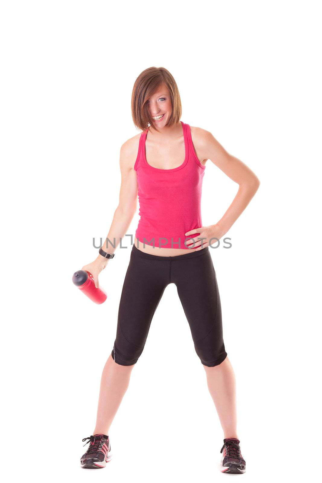 young beautiful sport woman laughing with a bottle isolated on white background