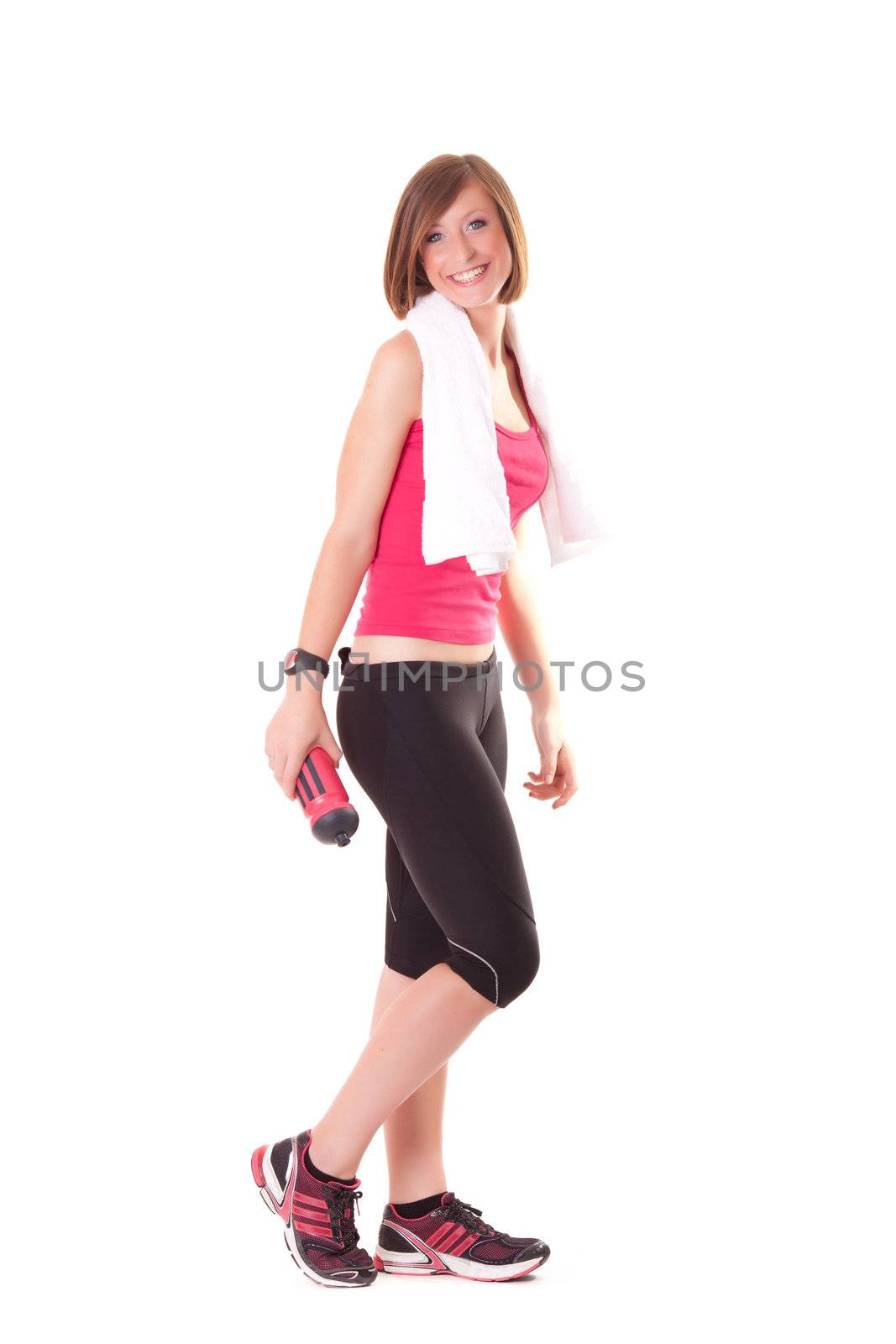 young beautiful sport woman standing with a towel isolated on white background