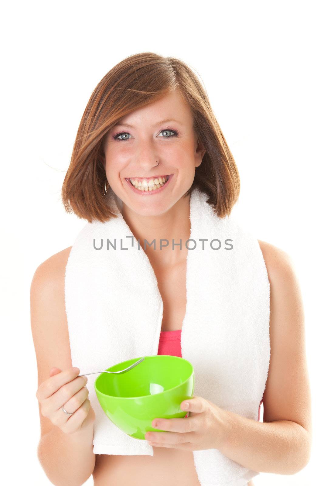 young beautiful sport woman laughing with a bowl isolated on white background