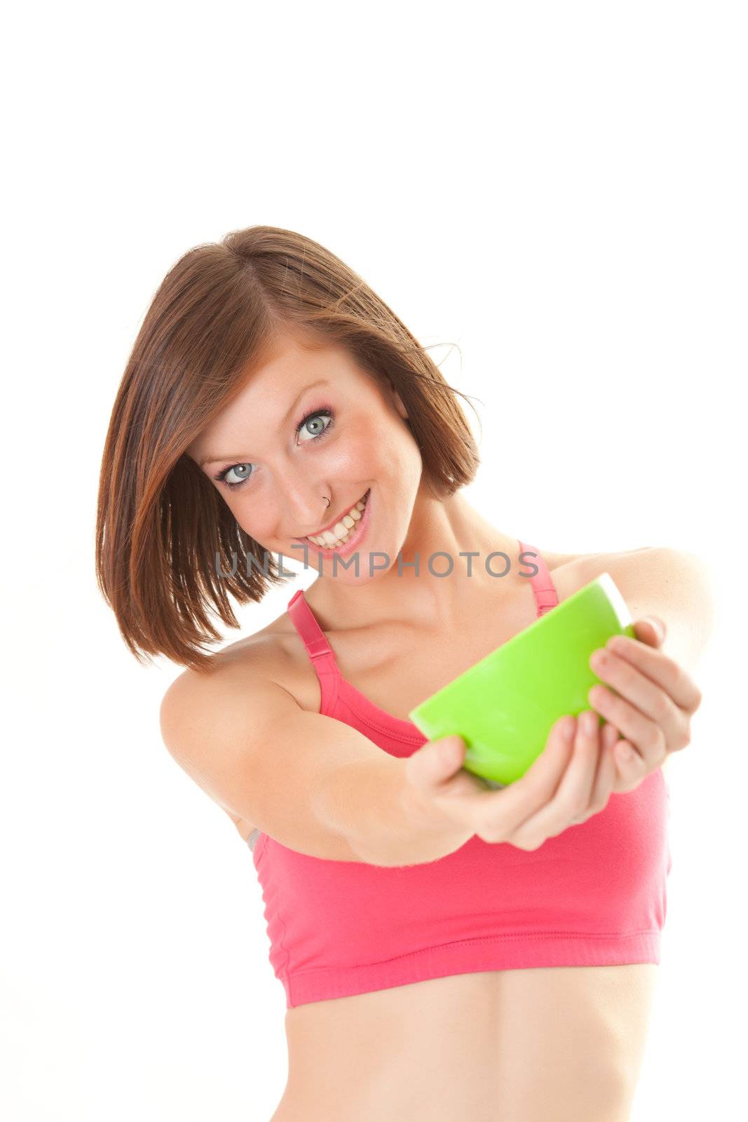 young beautiful sport woman laughing with a bowl isolated on white background