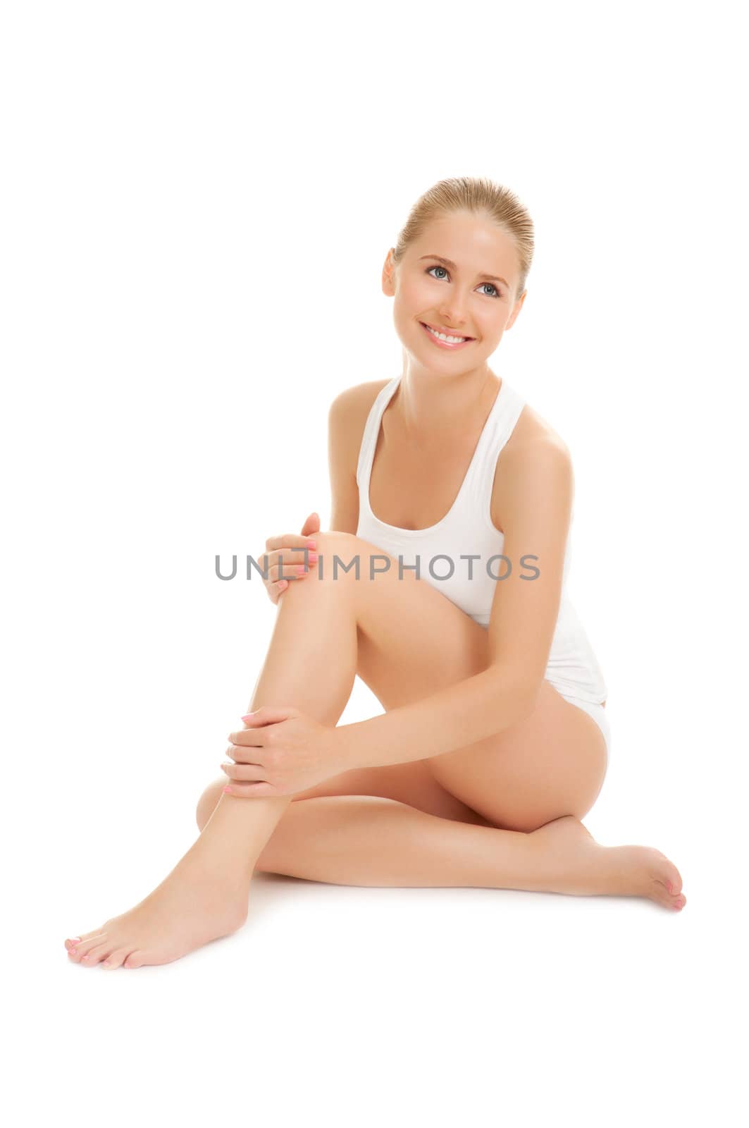 Young smiling woman sitting on the floor