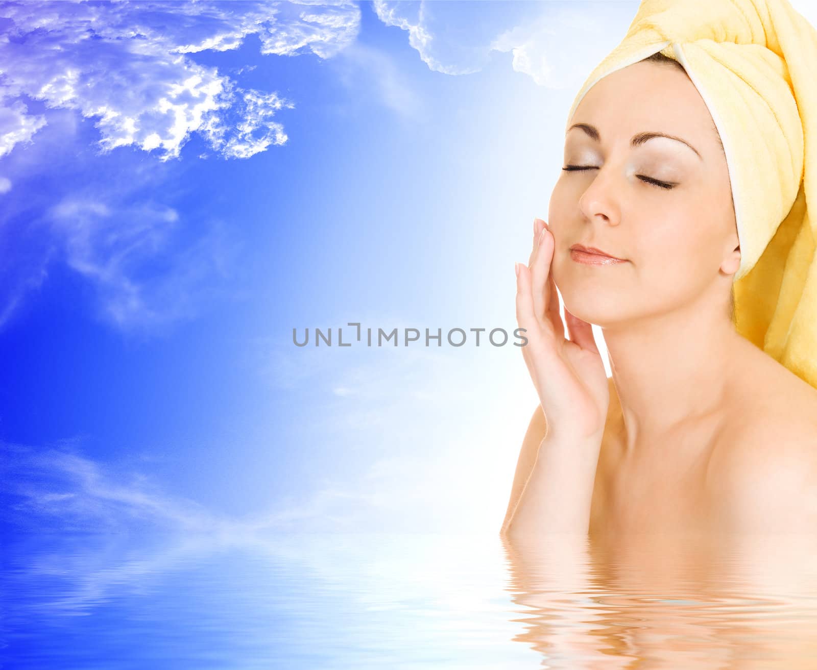 Young woman getting ready for the spa treatment on blue sky background