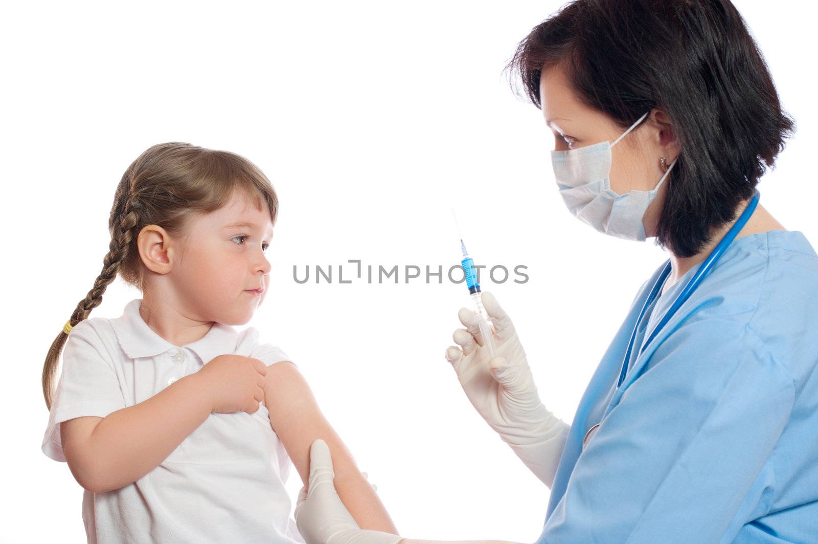 doctor does an inoculation to little girl