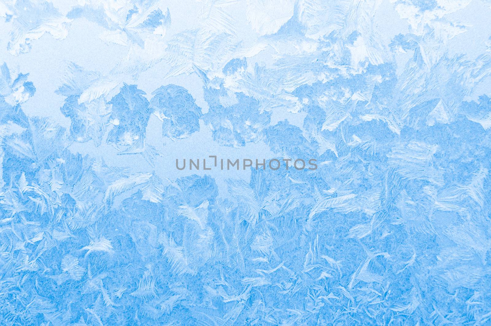 Light blue frozen window glass background