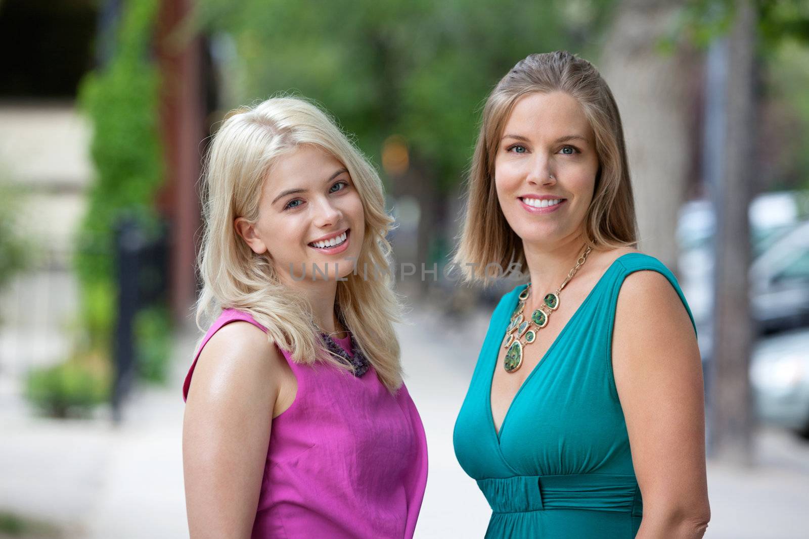 Portrait of beautiful young women in casuals smiling