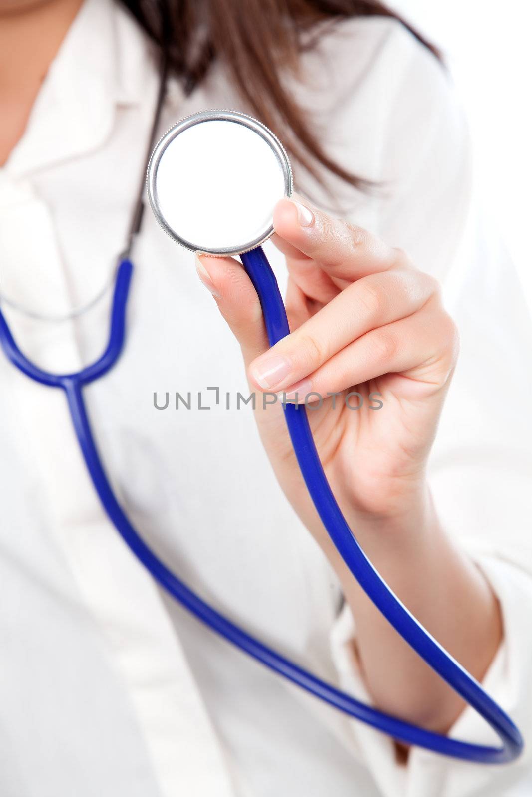 Closeup of a female doctor holding out a stethoscope to the camera