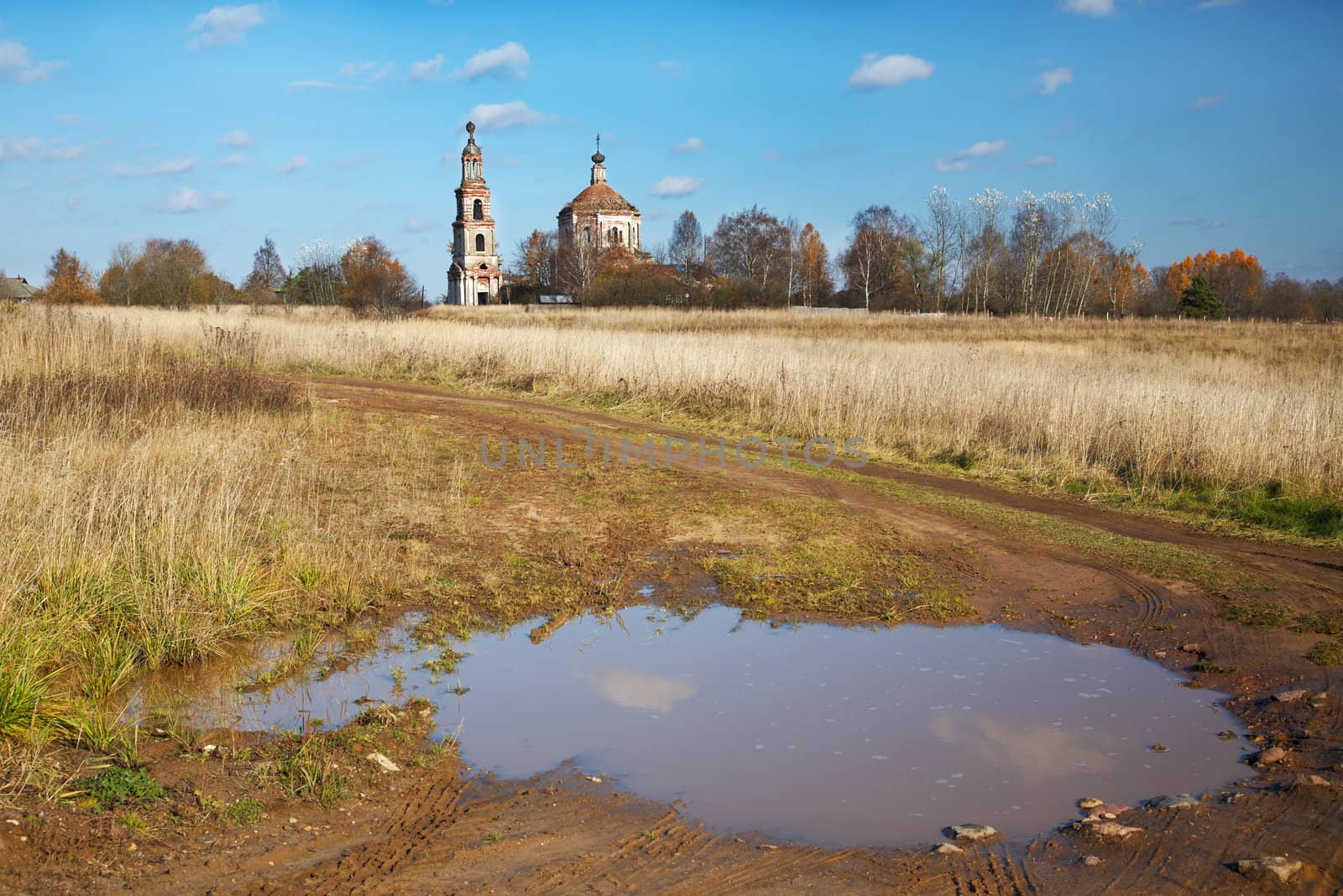 Rural landscape with the destroyed old church