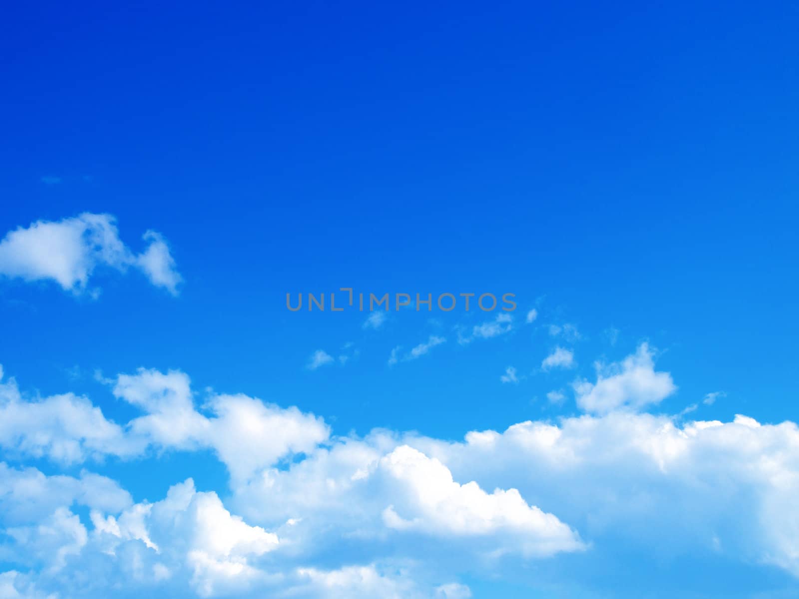 Blue sky with clouds and sun