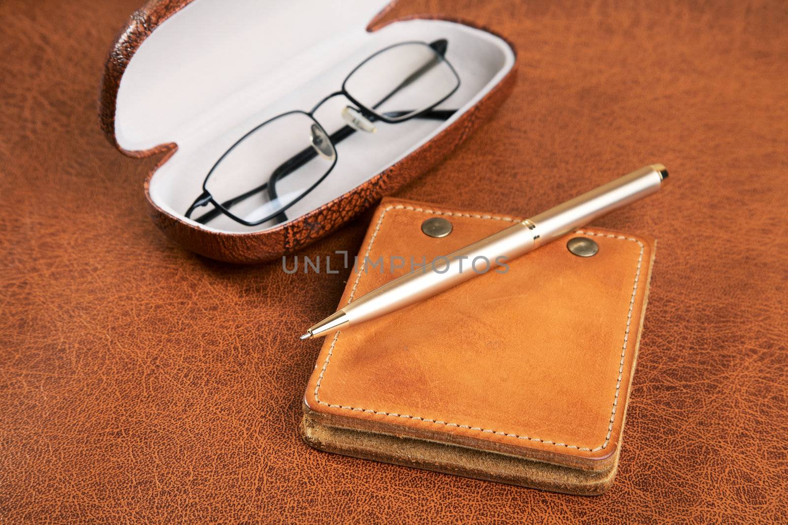 Business  still-life with a pen and glasses