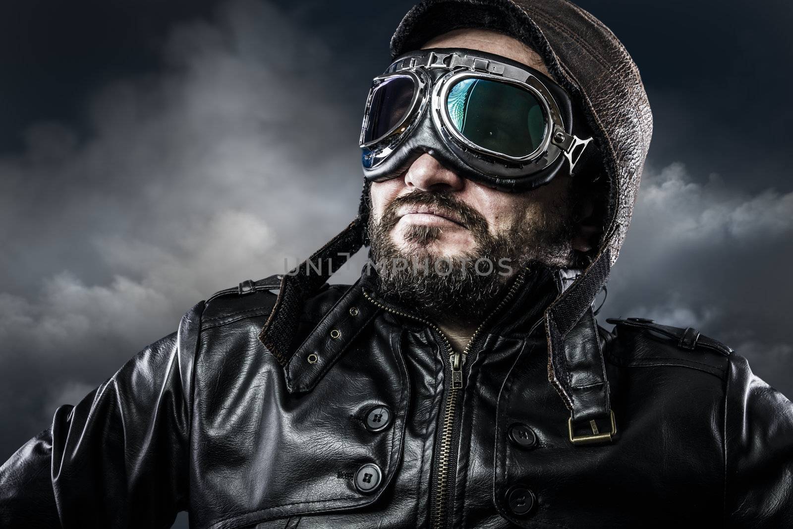 Aviator with glasses and vintage hat with proud expression