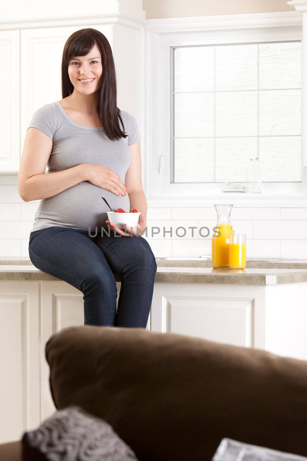 Smiling Pregnant Woman at Home by leaf