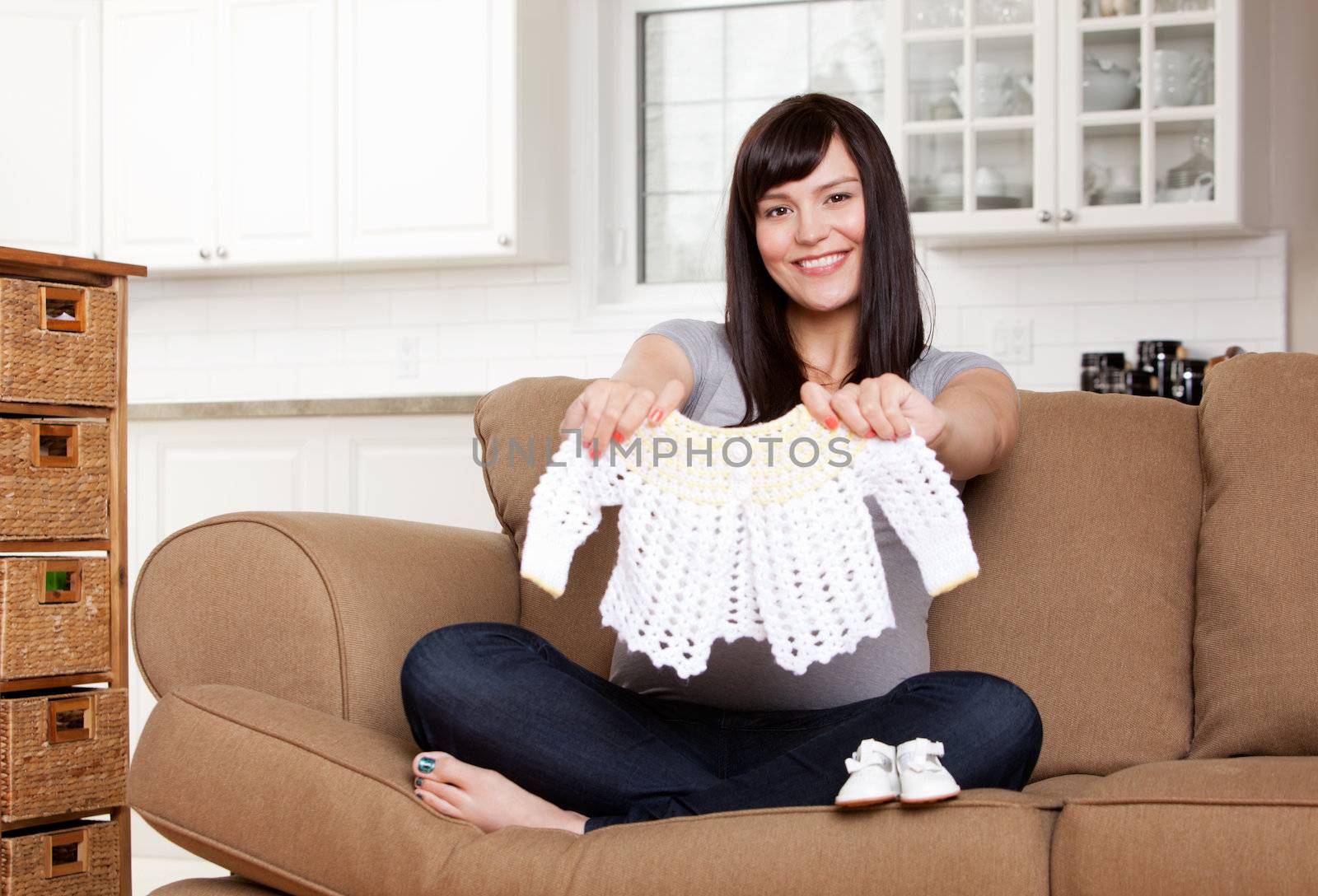 Expecting Mother with Baby Clothes by leaf