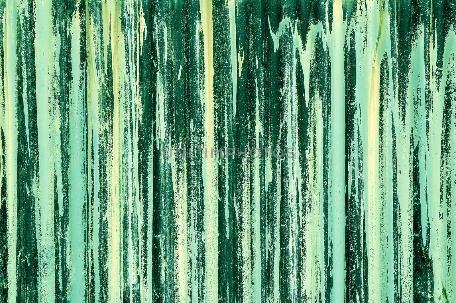 green streak abstract on corrugated iron barricade