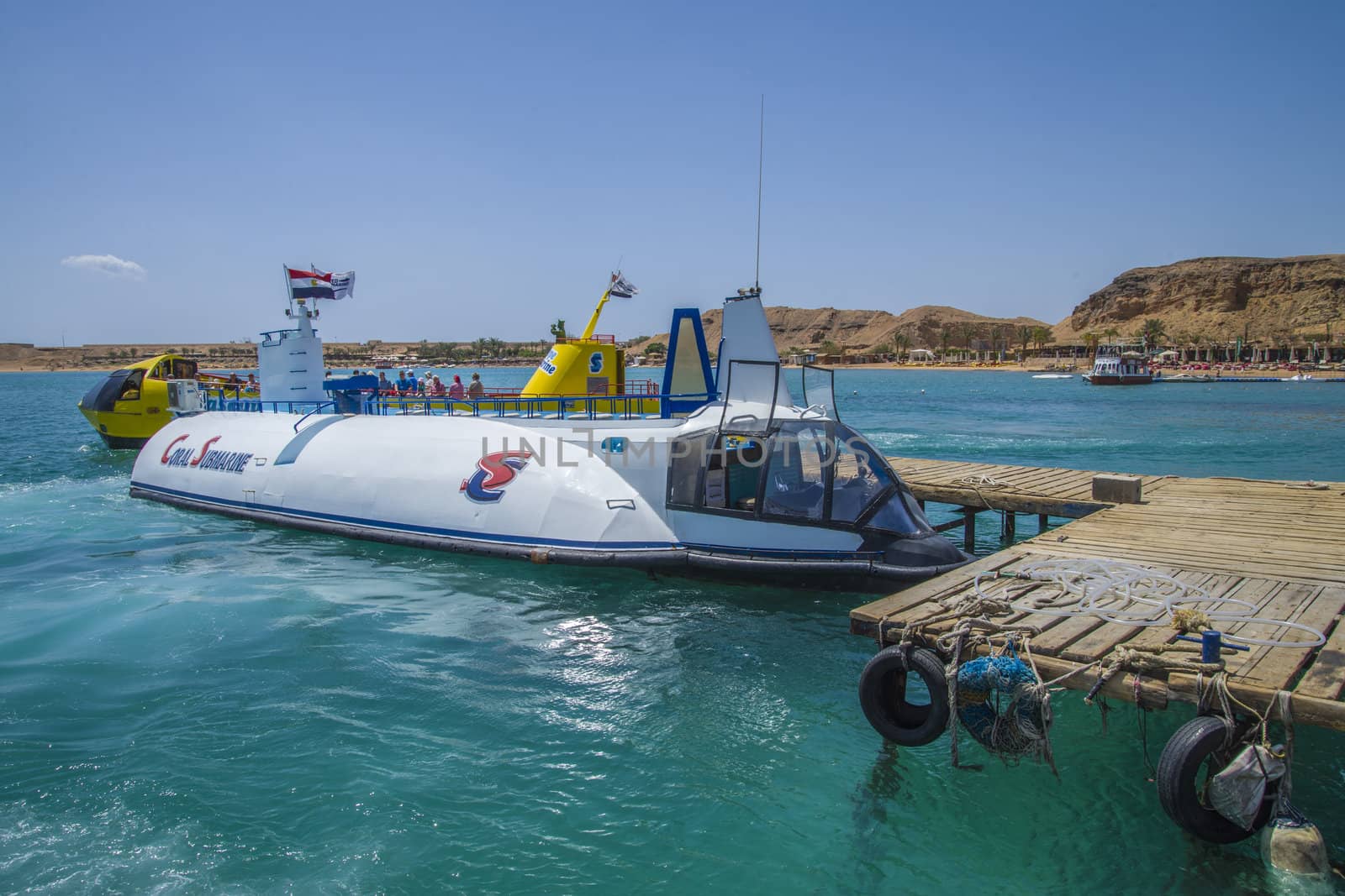 Boats that sail over the coral reefs in the bay of Sharm el Sheikh, Egypt. The picture is shot one day in April 2013.