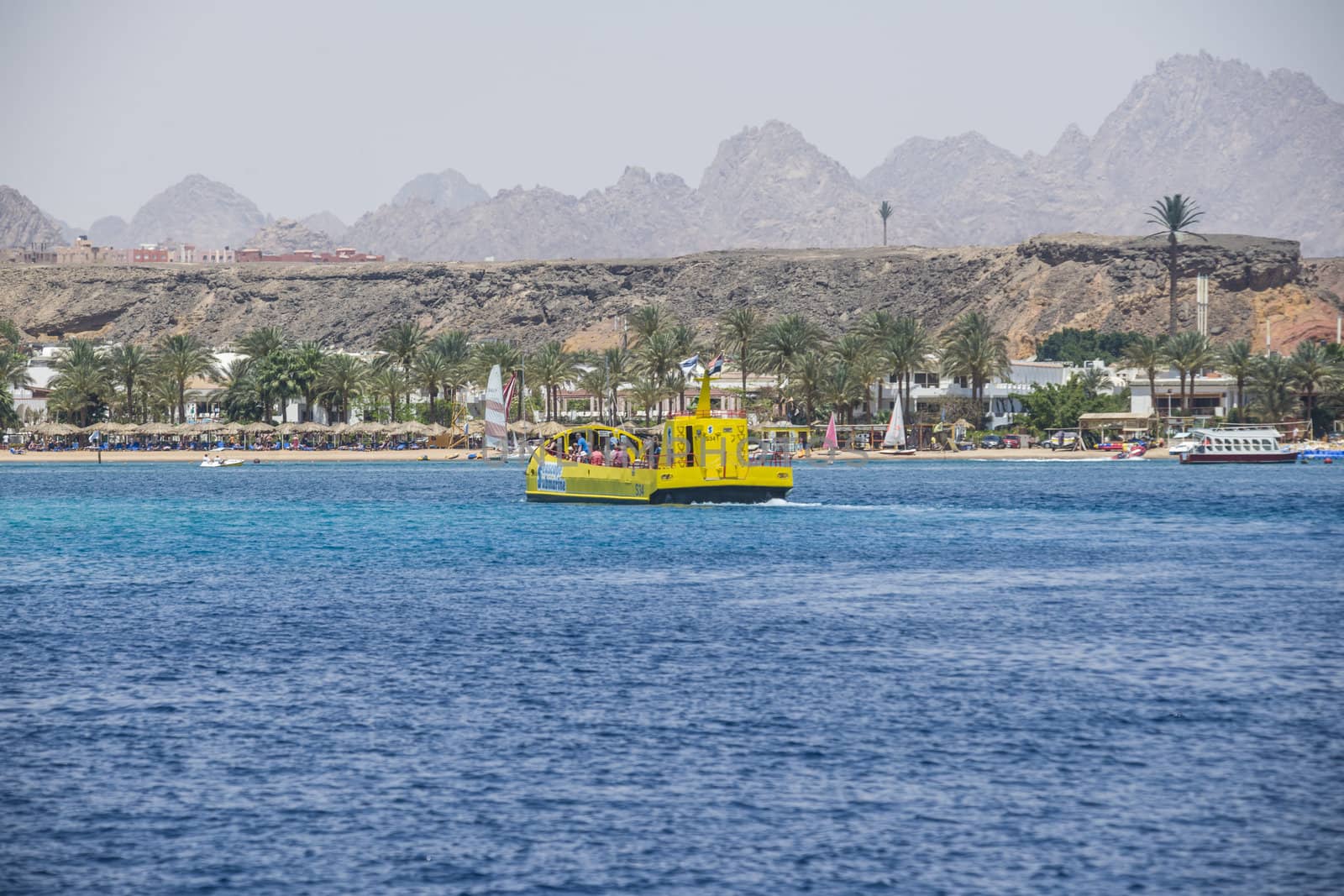 Boats that sail over the coral reefs in the bay of Sharm el Sheikh, Egypt. The picture is shot one day in April 2013.