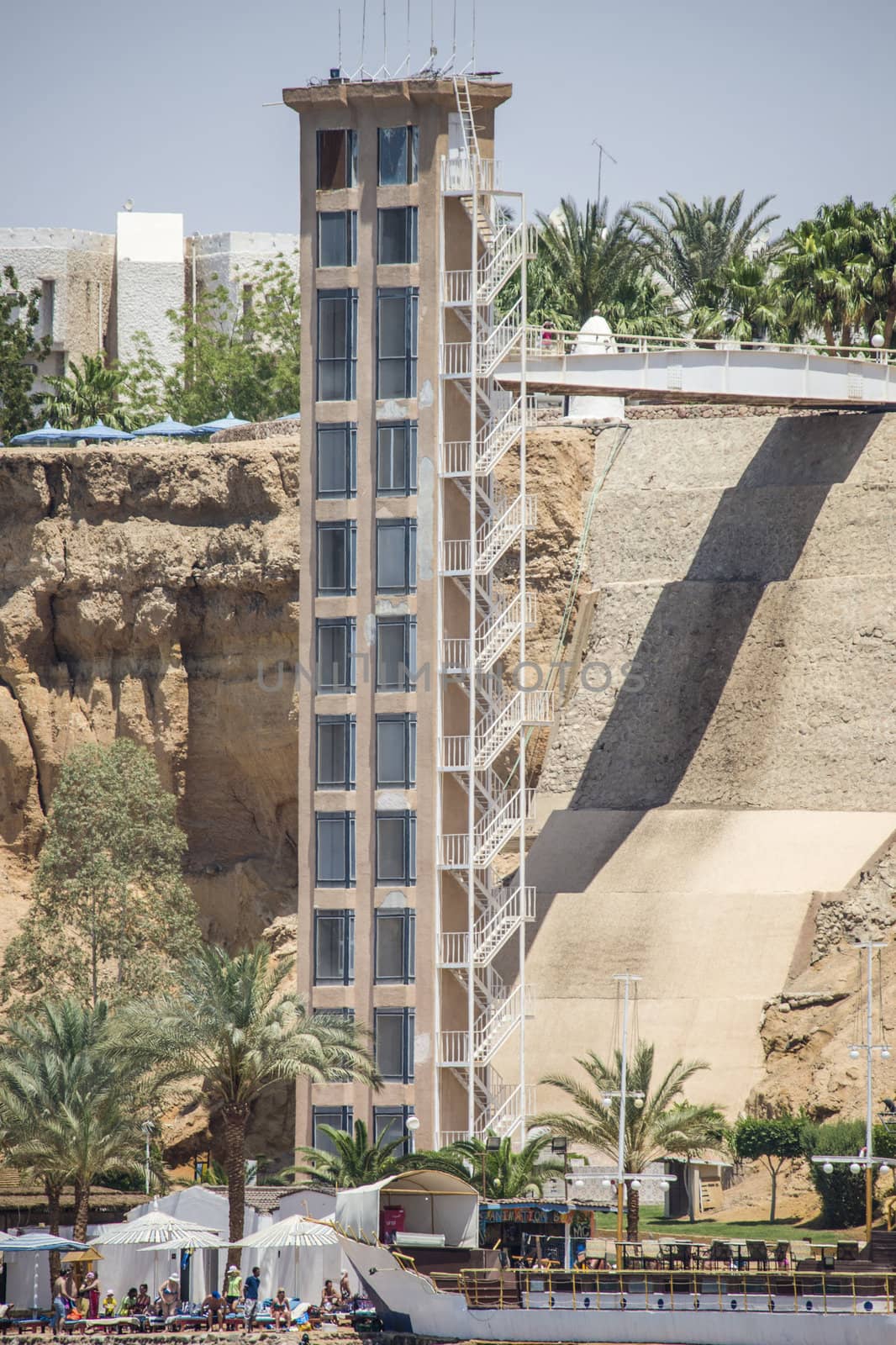 At a hotel in Sharm el Sheikh, Egypt has it built an elevator tower that runs from the cliffs and down to the beach. The picture is shot one day in April 2013.