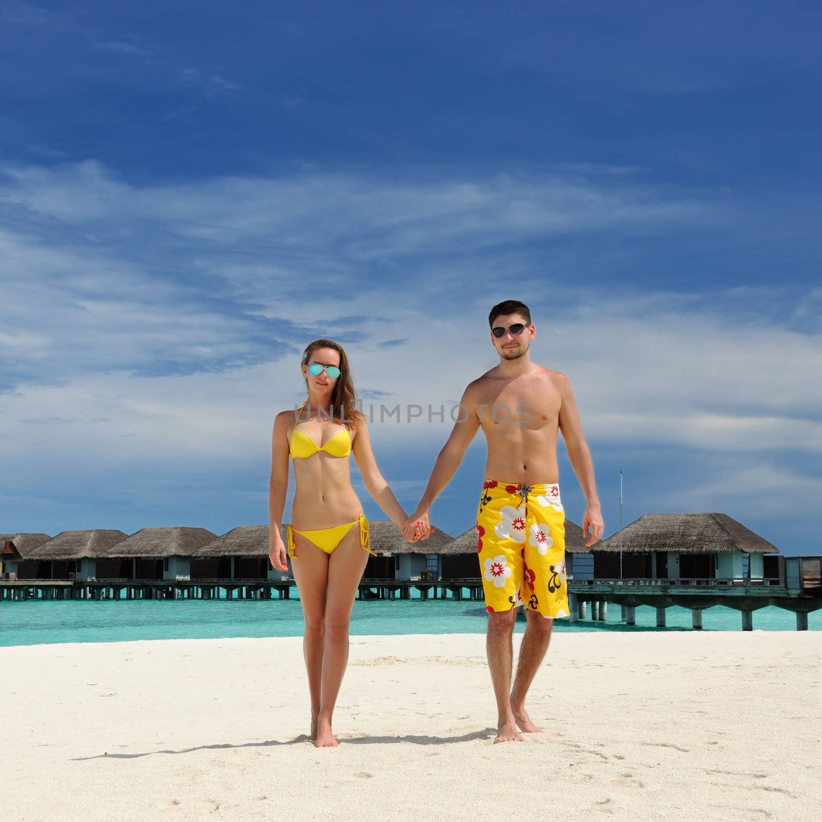 Couple on a tropical beach at Maldives